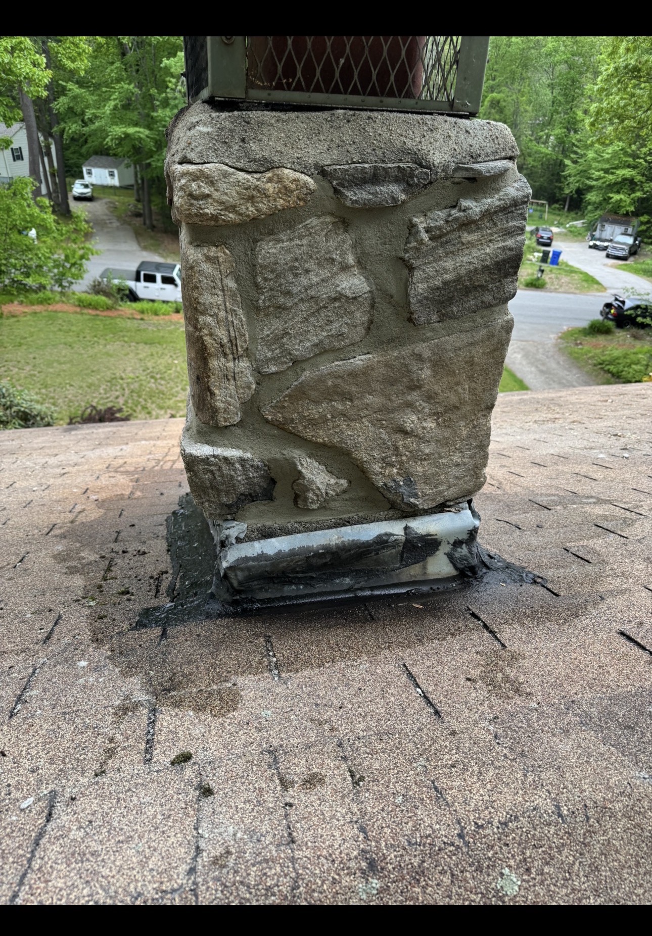 Stone chimney after restoration with repaired and repointed mortar joints